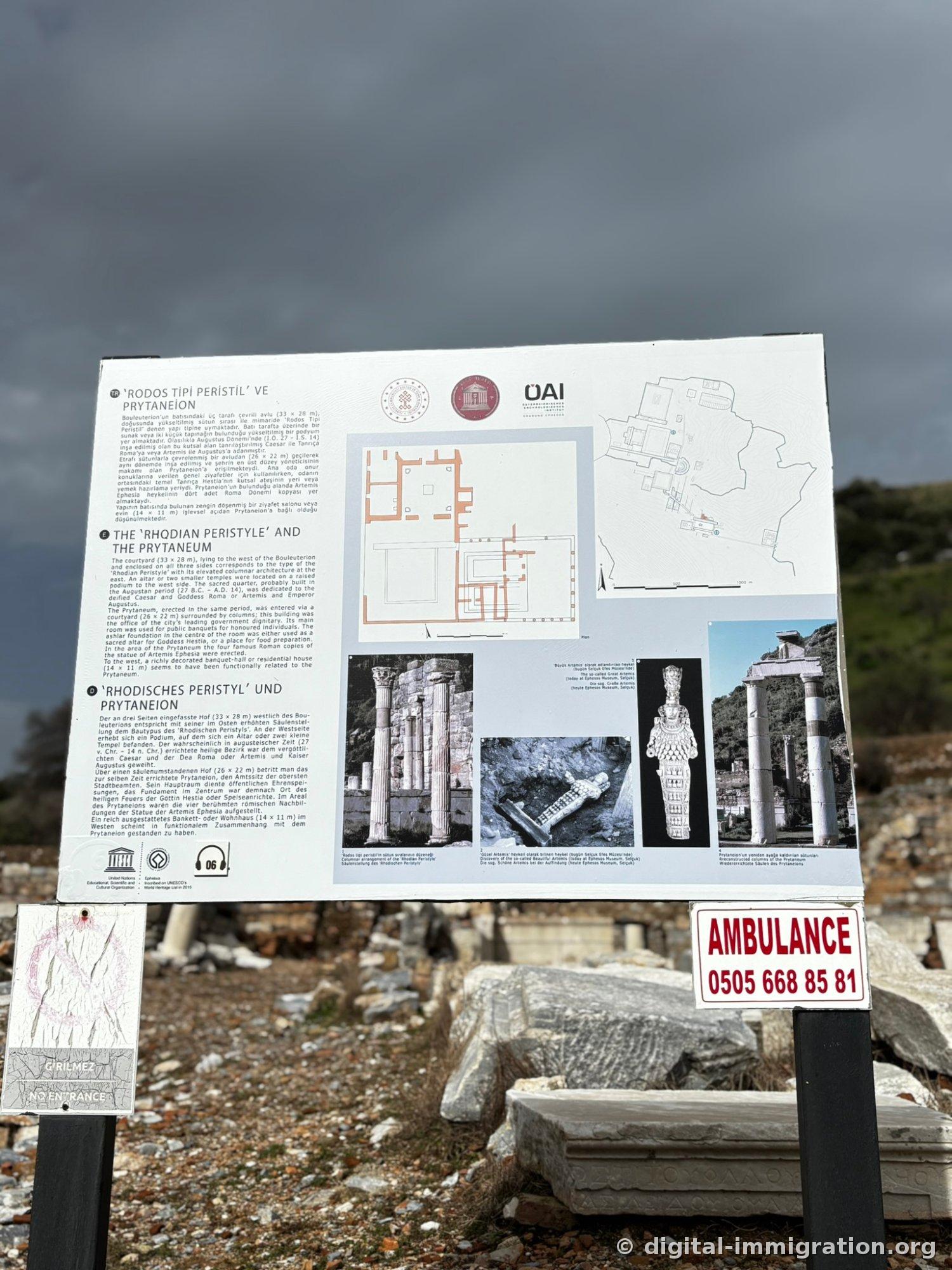 'RODOS TIPI PERISTIL VE PRYTANEION' trilingual signboard with a red 'AMBULANCE 0505 668 85 81' sign below it