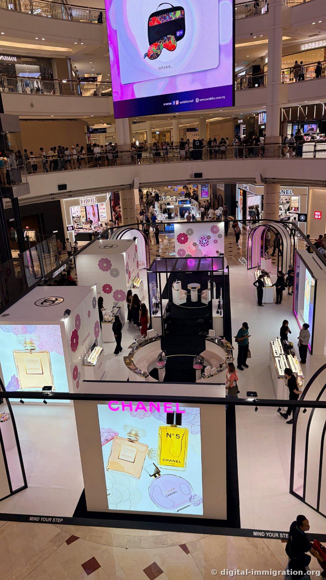 Chanel pop-up taking over the entire 1st floor plaza. With people clinging to every railing, movement to lower floors is subtly slow.