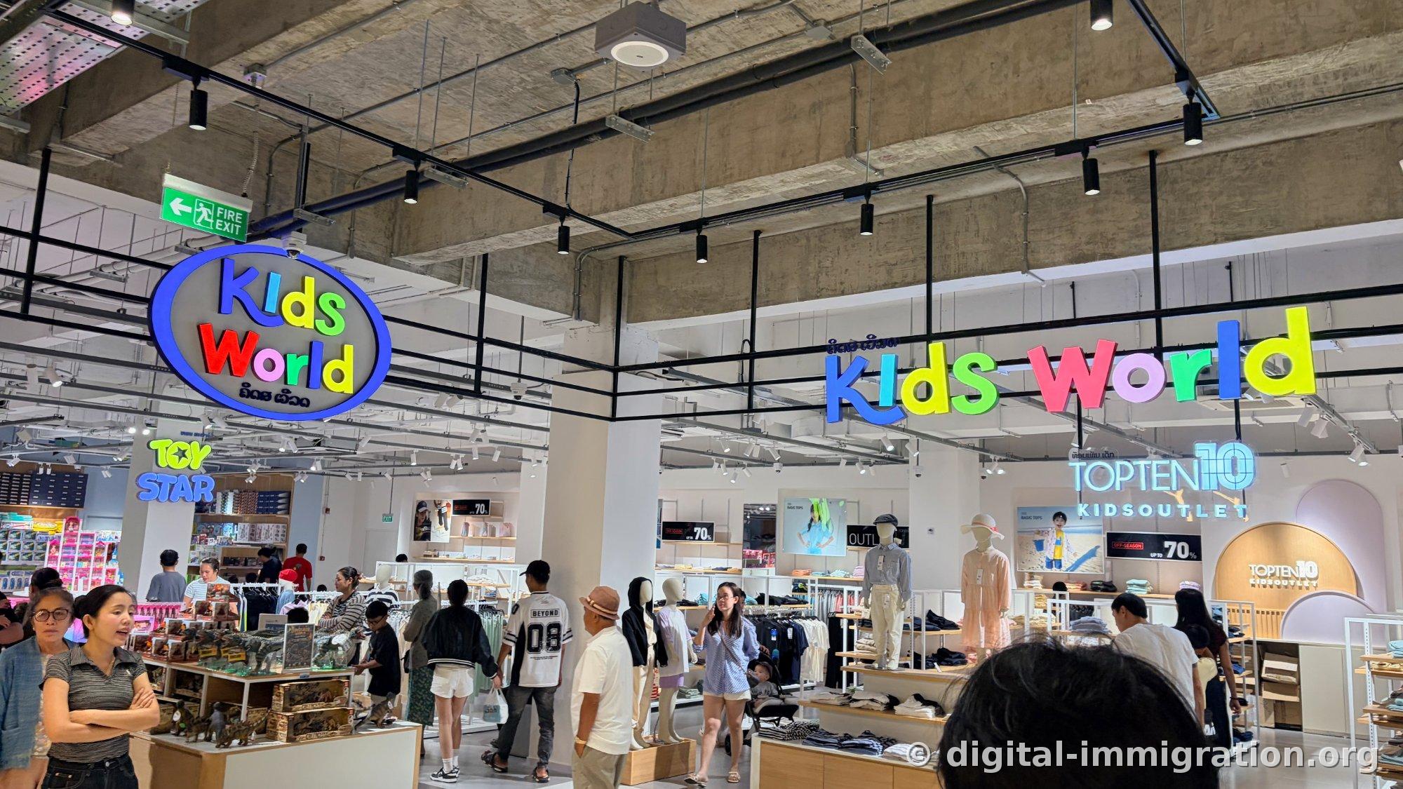 Colorful Kids World signage and TOY STAR toy corner, TOPTEN10 KIDSOUTLET store on right with 70% off signs