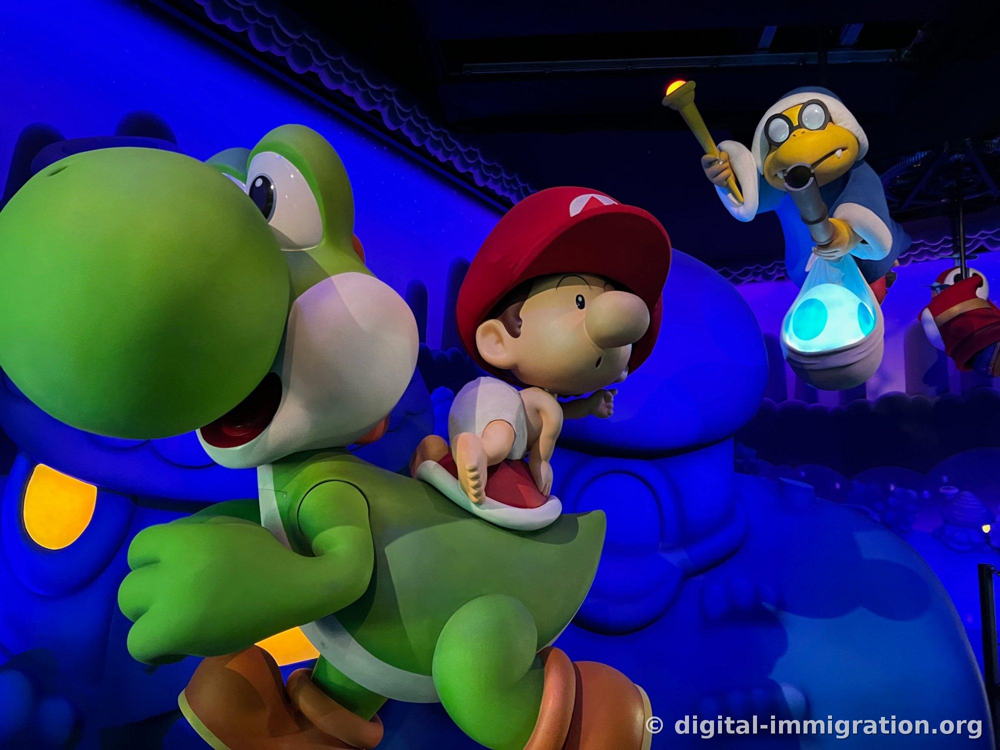 In the indoor section with blue lighting, a green Yoshi runs with Baby Mario wearing a red cap on his back, while bespectacled Kamek holds a blue egg sack from above