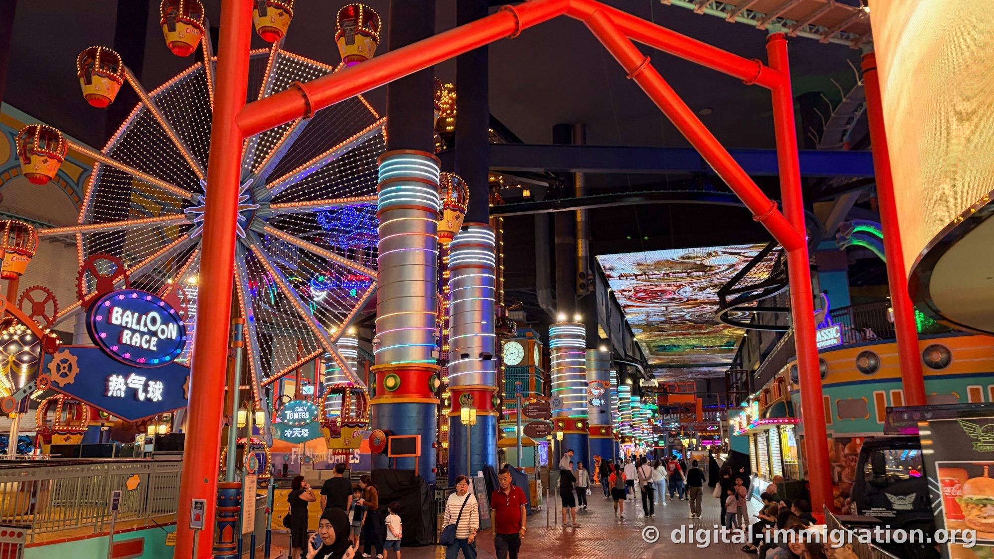 Indoor Ferris wheel BALLOON RACE hot air balloon sign and red steel structure with neon street extending inward and ceiling LED