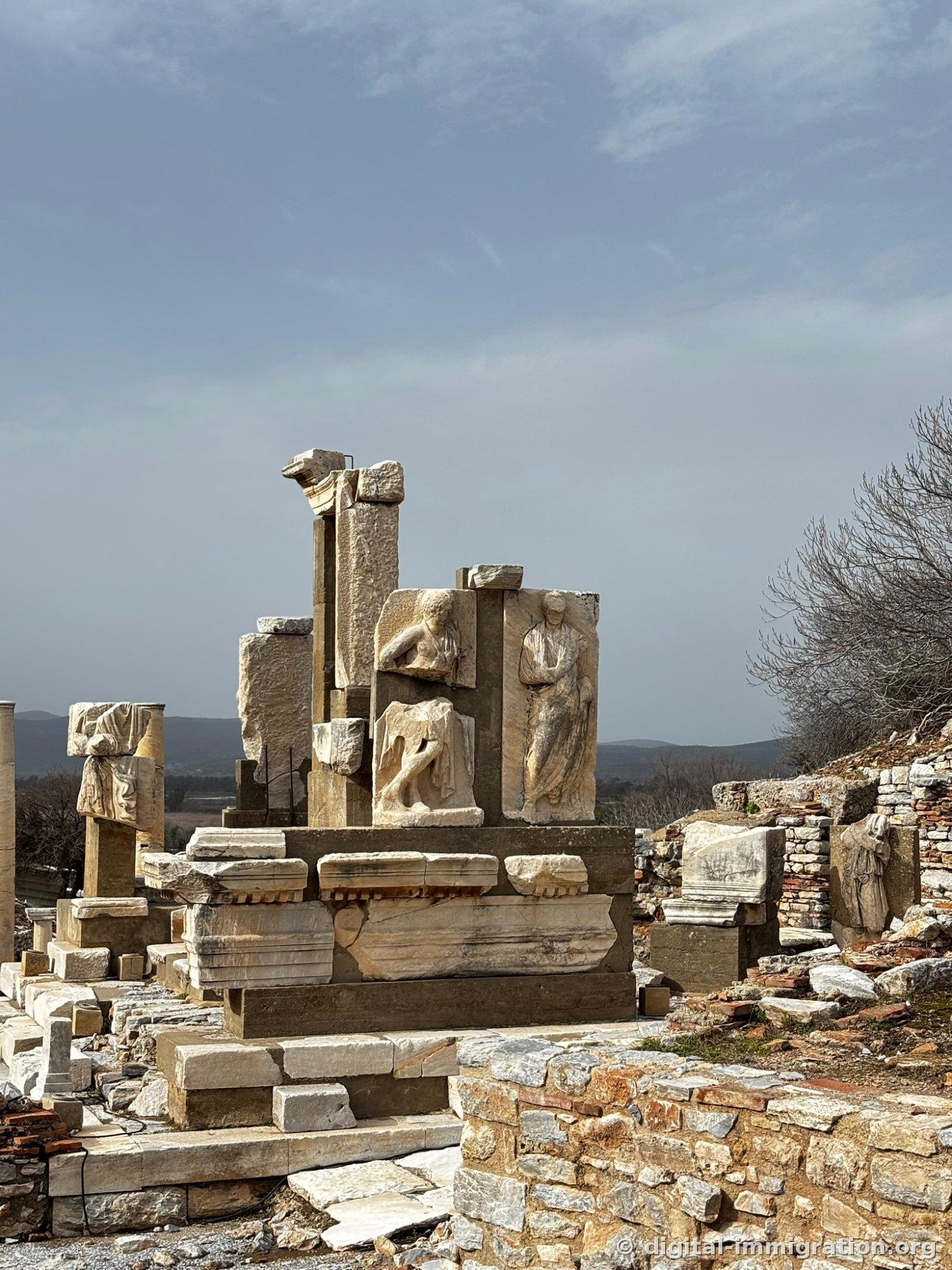 Three human figure reliefs remaining on the Monument of Memmius with Greek inscriptions carved on the lintel stone below