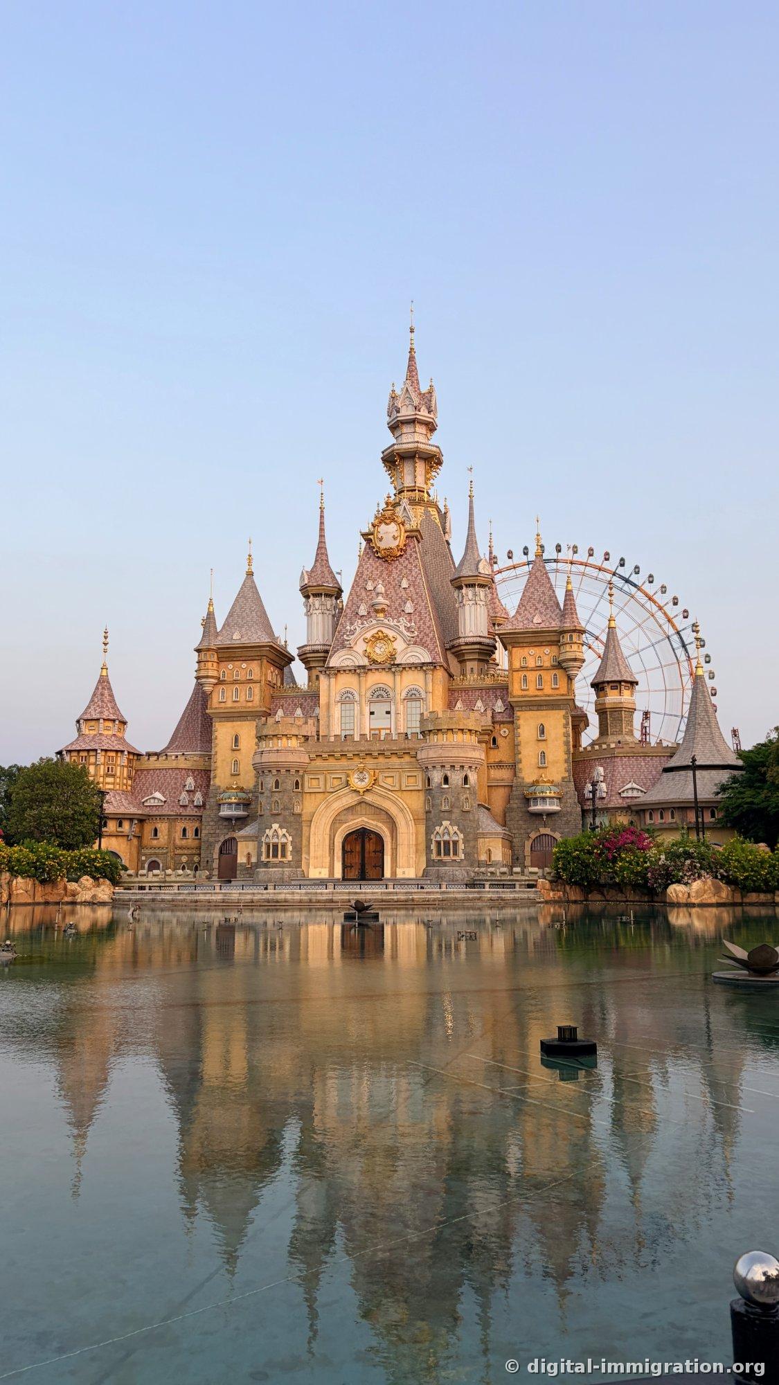 A complete castle reflection in a windless lake at sunset