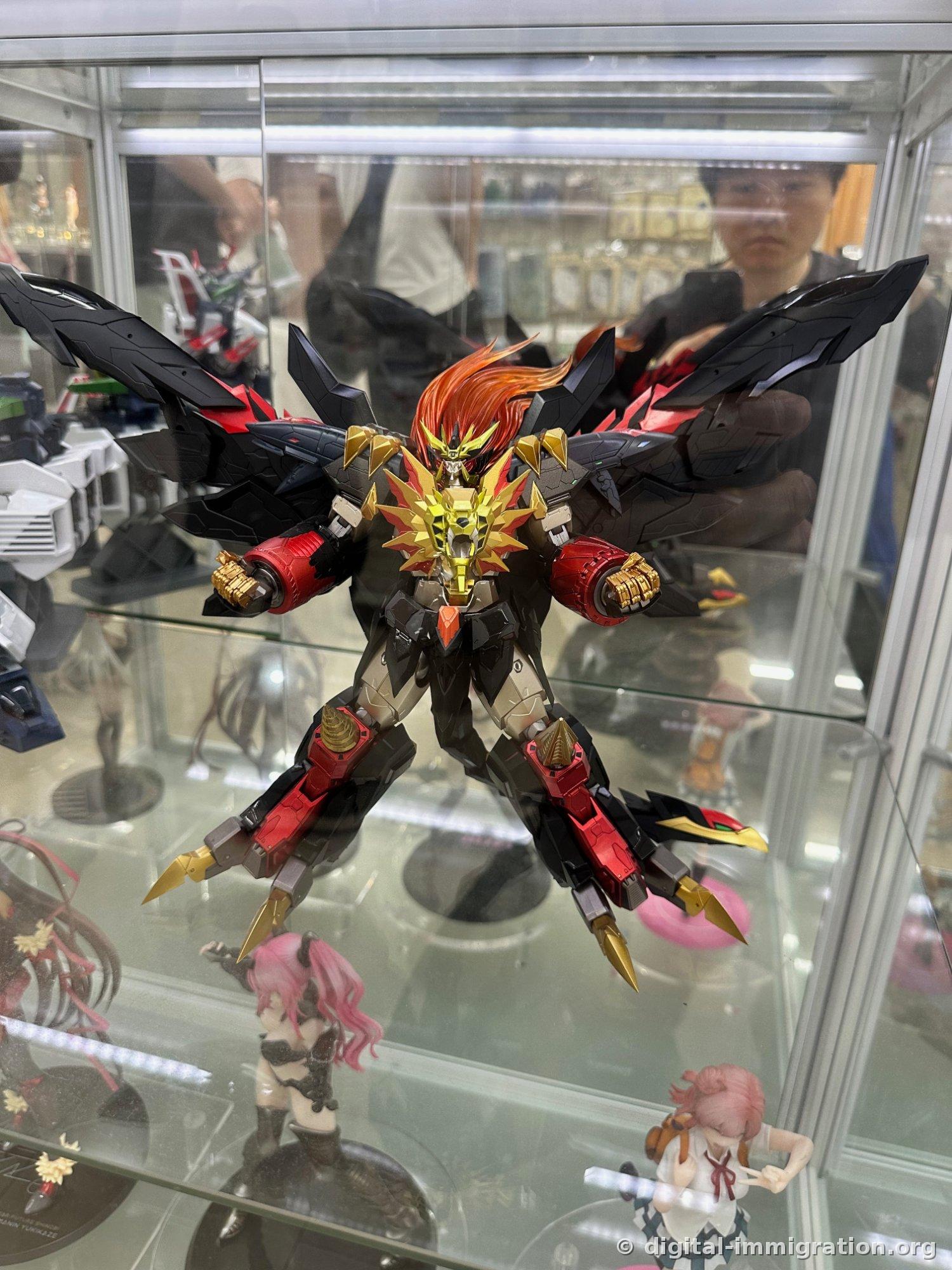 KAIYODO logo with large purple Evangelion Unit-01 figure and Revoltech poster