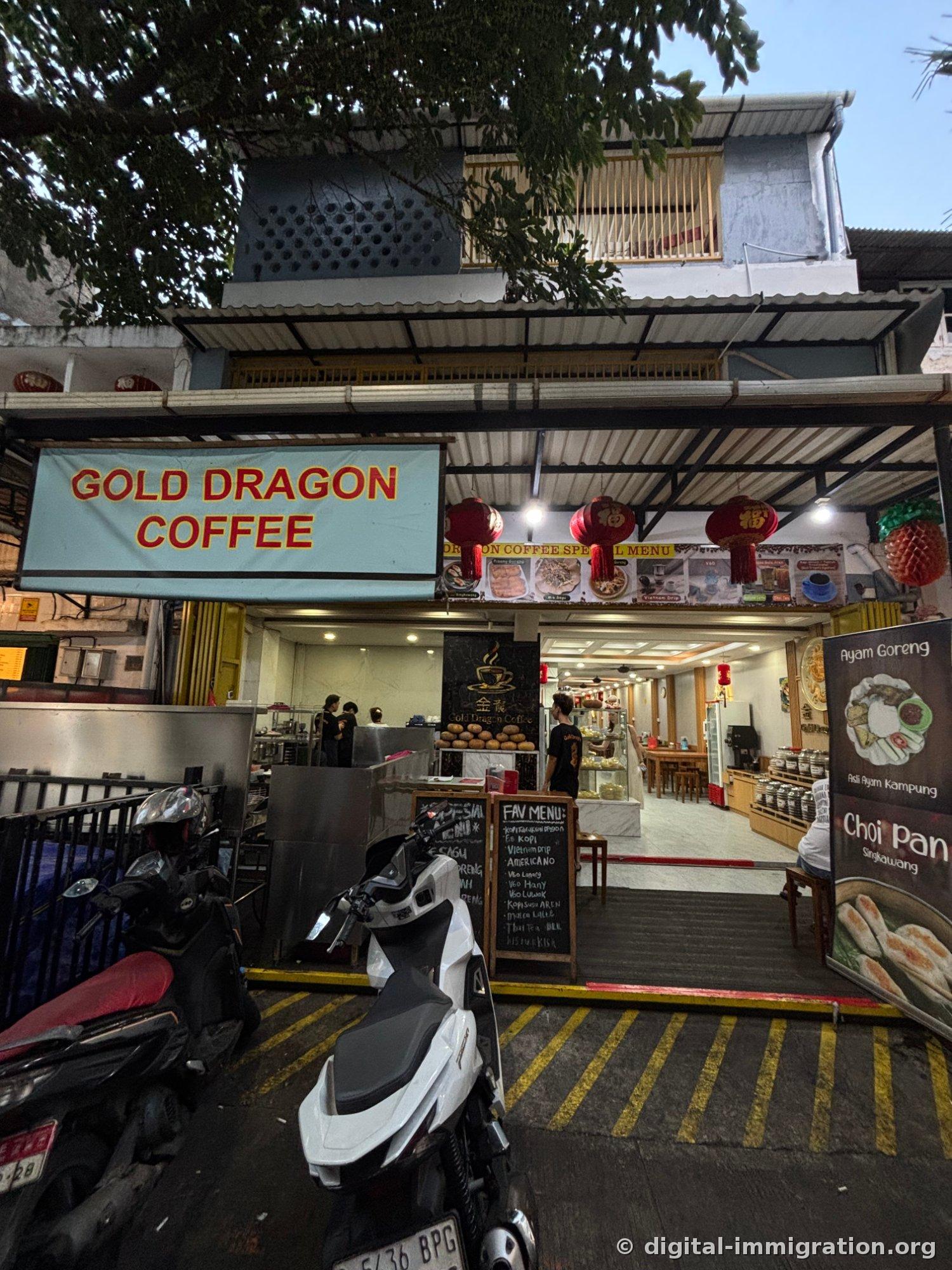 'GOLD DRAGON COFFEE' storefront with light blue signage, red lanterns and a handwritten 'FAV MENU' chalkboard, with two motorcycles parked in front