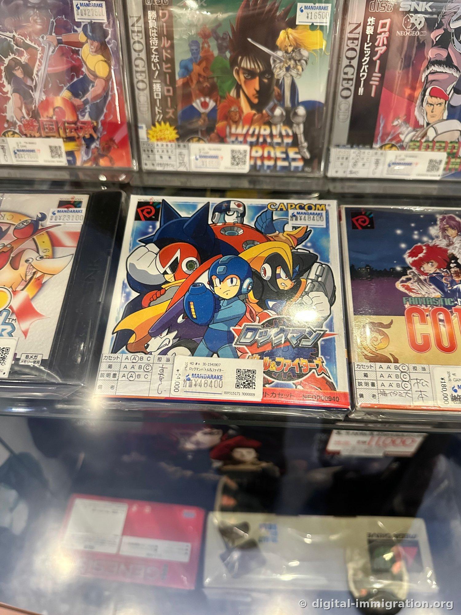 Neo Geo Pocket Rockman Battle and Fighters package with ¥48,400 price tag in display case